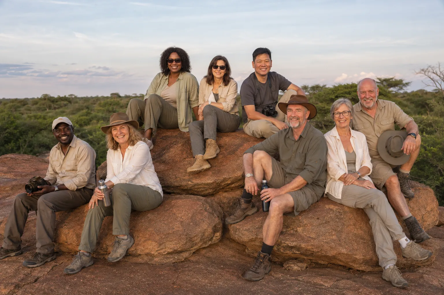Safari group and guide overlooking African bushland