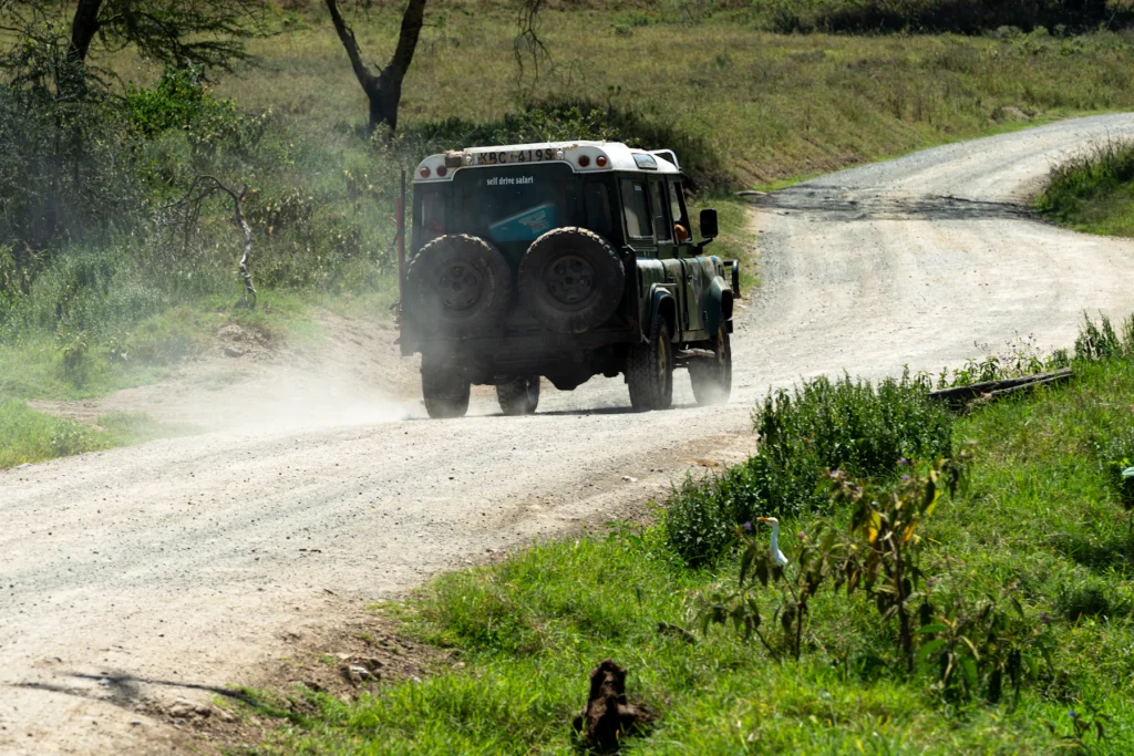 Safari vehicle travelling on a dirt road